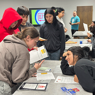 Students getting help from an escape room strategist
