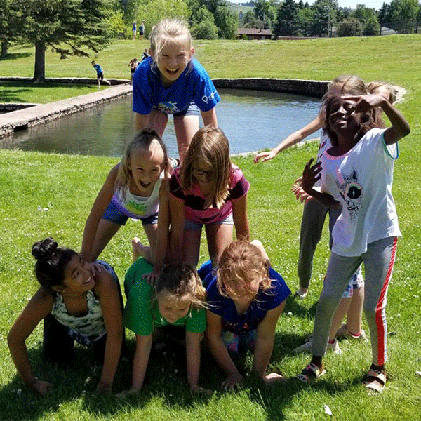 Group of young girls forming a human pyramid